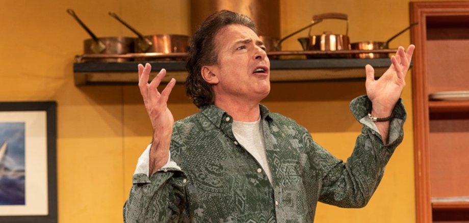 The photo shows the actor playing Richard with his hands up in supplication.