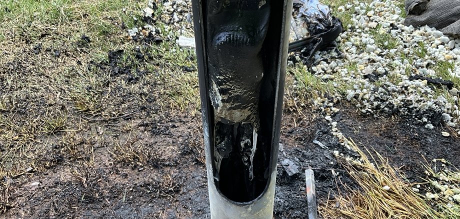 The photo shows a detailed view of the scorched cables.