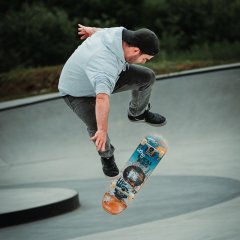 The photo shows a skater jumping.